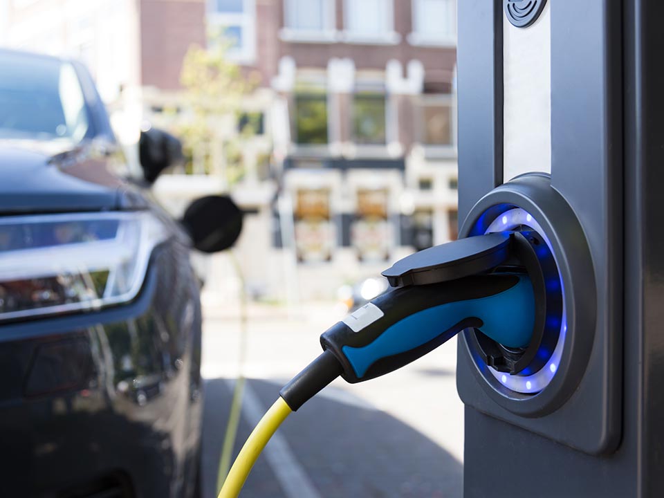 EV charger plugged into a vehicle during installation at a commercial site in Canberra